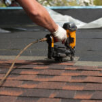 roofers installing new roof on house